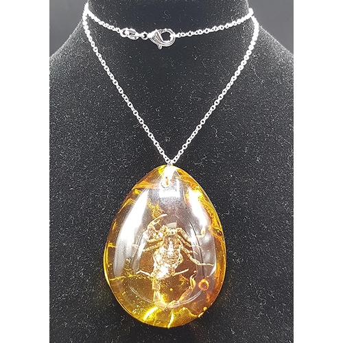 209 - ENCASED SCORPION PENDANT