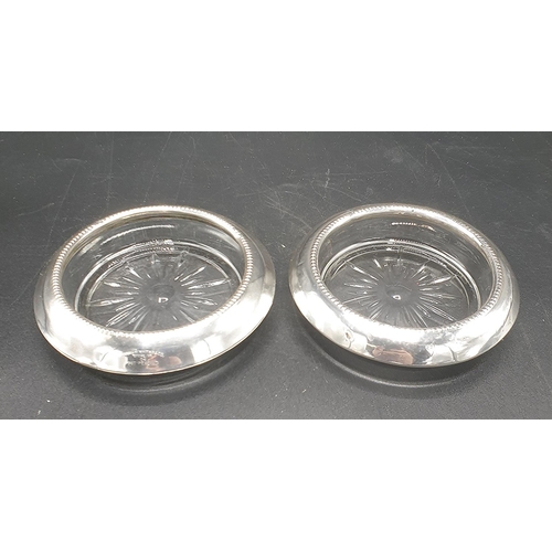 548 - PRESENTED AS A PAIR OD STERLING SILVER And GLASS 10cm Dia COASTERS