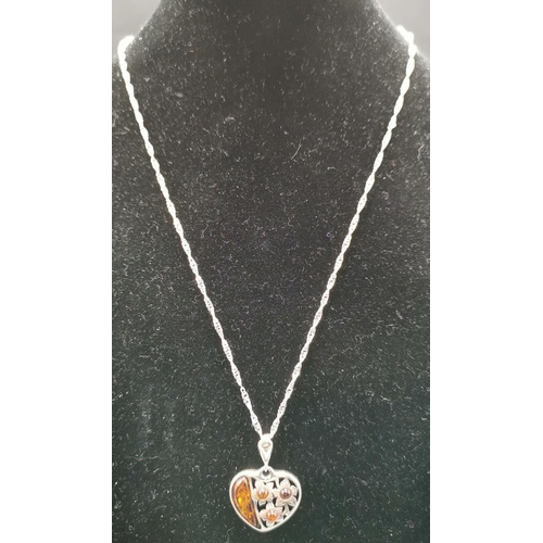 558 - PRESENTED AS A SILVER (Stamped 925) & BALTIC AMBER FLORAL HEART PENDANT ON A 40cm NECK CHAIN  (Total... 