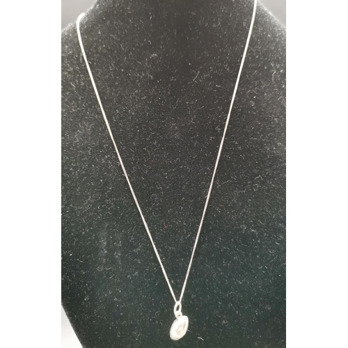 562 - PRESENTED AS A SILVER (Stamped 925) RUGBY BALL PENDANT ON A 46cm NECK CHAIN (Total Weight 4.3 Grams)... 