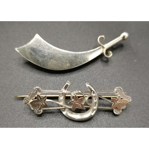 575 - PRESENTED AS TWO SILVER (Hallmarked) BROOCHES (One A Scimitar,The Other A Sword) TOGETHER WITH A LUC... 