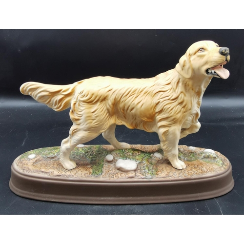 713 - ROYAL DOULTON MODEL OF A GOLDEN RETREIVER MOUNTED ON A CERAMIC PLYNTH