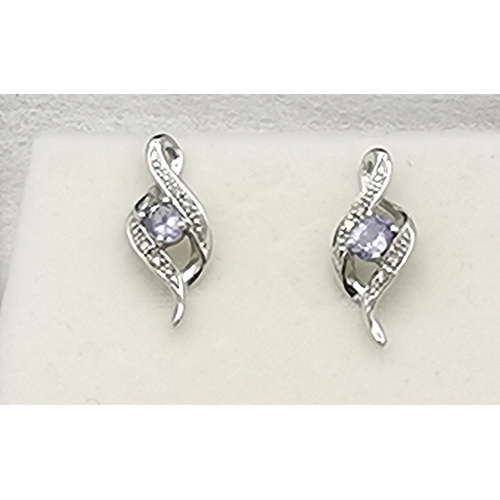 1011 - PRESENTED AS A PAIR OF 9ct WHITE GOLD (Hallmarked 9ct And Diamond) EARRINGS  (No Backs)  (Weight 1.4... 