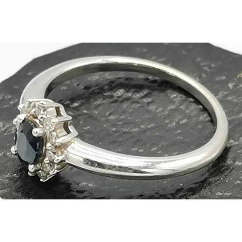 1023 - PRESENTED AS A 14KT WHITE GOLD DIAMOND/SAPPHIRE DRESS RING (Size N/O , Weight 2.8 Grams)