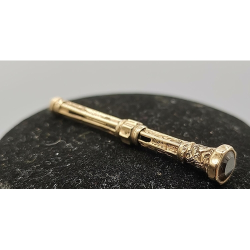 1025 - PRESENTED AS A 9ct GOLD (Hallmarked) MECHANICAL PENCIL With CITRINE JEWELLED TOP (Weight 2.7 Grams)