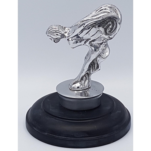 676 - POLISHED ALUMINIUM SPIRIT OF ECSTASY ON WOODEN PLYNTH