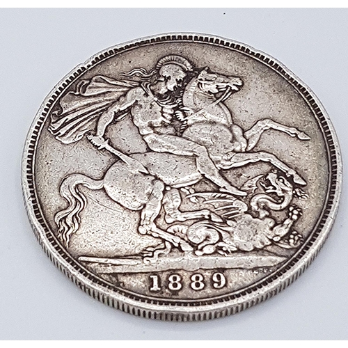 678 - PRESENTED AS A SILVER VICTORIAN CROWN (Dated 1889)