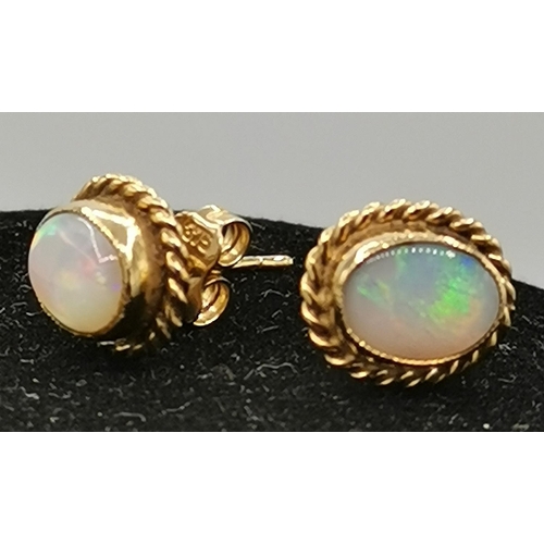 981 - PRESENTED AS A PAIR OF 9ct GOLD (375) OPAL EARRINGS (Hallmarked To Stems) (Weight 2.1 Grams)