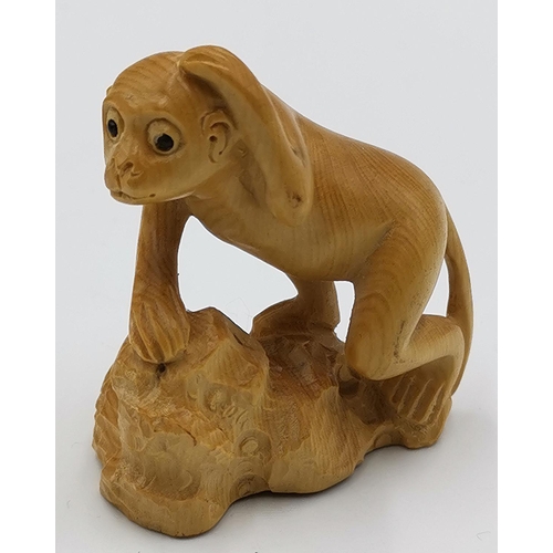 1322 - BOXWOOD NETSUKI IN THE FORM OF A MONKEY