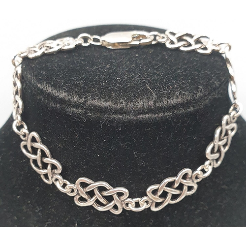 1058 - PRESENTED AS A SILVER (925) 18cm CELTIC DESIGN BRACELET (Total Weight 9.77 Grams)