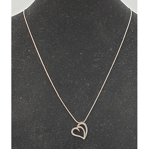 105A - PRESENTED AS A SILVER (925) HEART PENDANT ON A 42cm NECK CHAIN  (Total Weight 3.85 Grams)