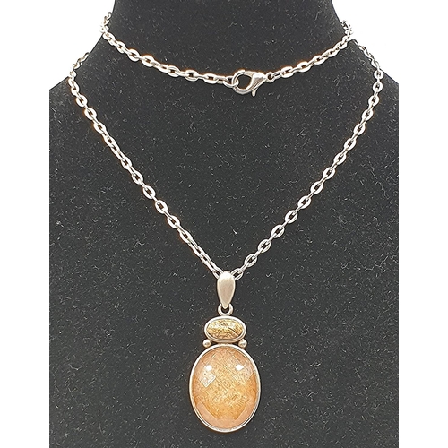 1070 - PRESENTED AS A SILVER AMBER ?? PENDANT ON A SILVER (925) 50cm NECK CHAIN (Total Weight 11.62 Grams)