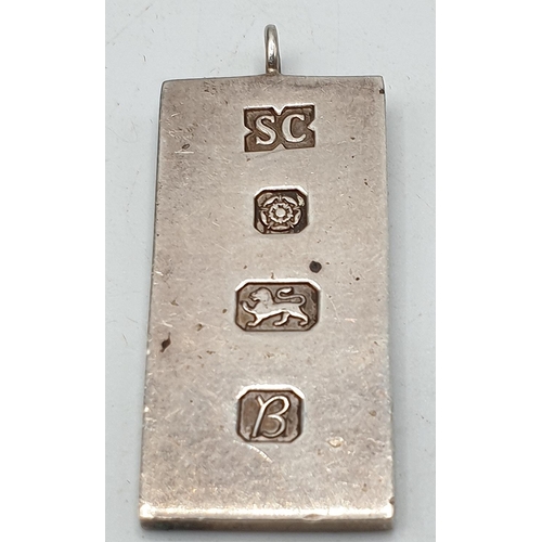 115A - PRESENTED AS A SILVER (Hallmarked) 4cm INGOT PENDANT (Total Weight 16.78 Grams)