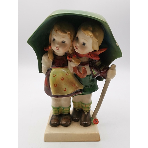 63 - BESWICK 15cm FIGURINE OF A BOY & GIRL UNDER AN UMBERELLA 