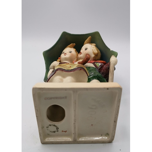 63 - BESWICK 15cm FIGURINE OF A BOY & GIRL UNDER AN UMBERELLA 