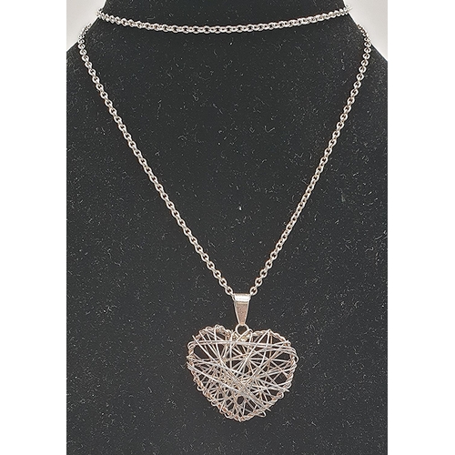 639 - PRESENTD AS A  HEART SHAPED PENDANT ON A SILVER 50cm NECK CHAIN (Total Weight 3.7 Grams) (Old) (Boxe... 