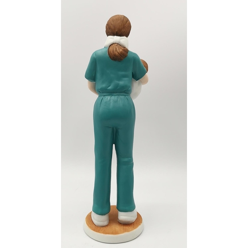 68 - LEFTON CHINA SRI LANKA 20cm CHARACTER FIGURINE OF A NURSE WITH A BABY