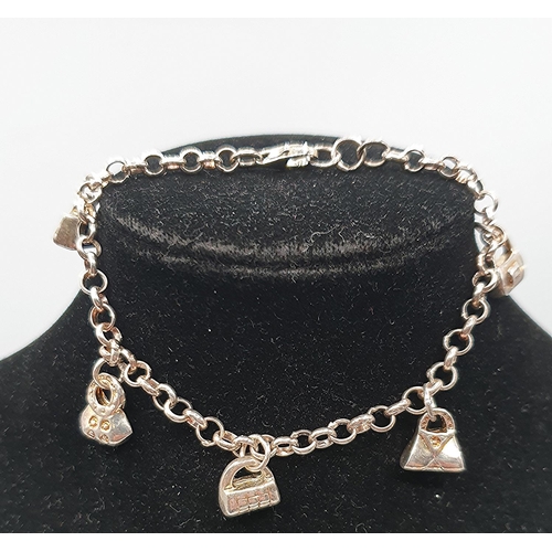 834 - PRESENTED AS A SILVER (925) 18cm BAG CHARM BRACELET (Total Weight 13.69)  (Boxed)