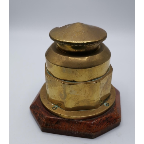 84 - BRASS INDUSTRIAL 11cm INKWELL ON A PLINTH