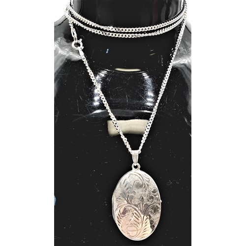 82 - PRESENTED AS A  SILVER (925) LOCKET ON A SILVER (925) 60cm NECK CHAIN (Total Weight 12.30 Grams)