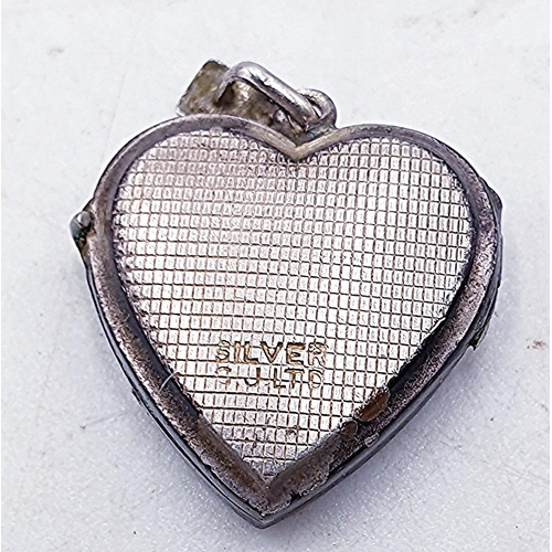 145 - PRESENTED AS A SILVER (Stamped) HEART SHAPED LOCKET (Total Weight 3.00 Gram)