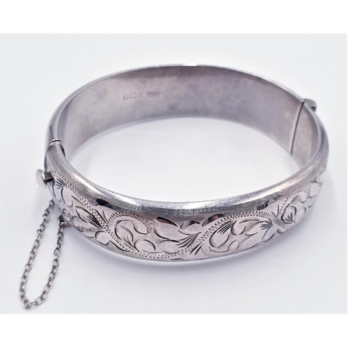 362 - PRESENTED AS A SILVER (Hallmarked) ENGRAVED BANGLE With SAFETY CHAIN (Total Weight 25.70 )