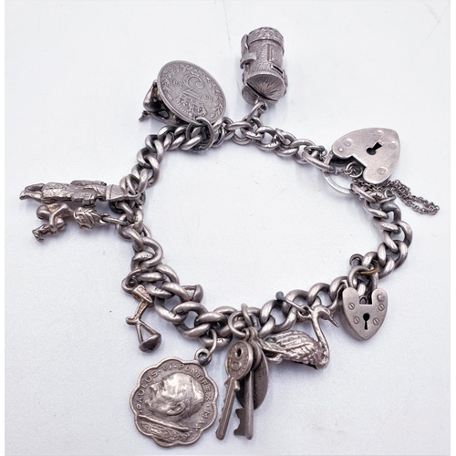 143 - STERLING SILVER CHARM BRACELET With 10 CHARMS To Include RARE POSTMAN INSIDE POSTBOX, NUDE MODEL WIT... 