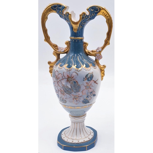 86 - ROYAL DUX PORCELAIN 28.5cm TWIN HANDLED VASES (Pair).
(The Dux (Duchcov) factory was established in ... 