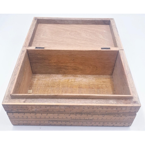 132 - WOODEN 29cm x 18cm (Hand Made) BOX  COVERED IN RULERS