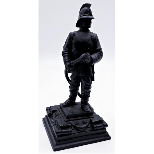 79 - FIGURINE OF A FIREFIGHTER