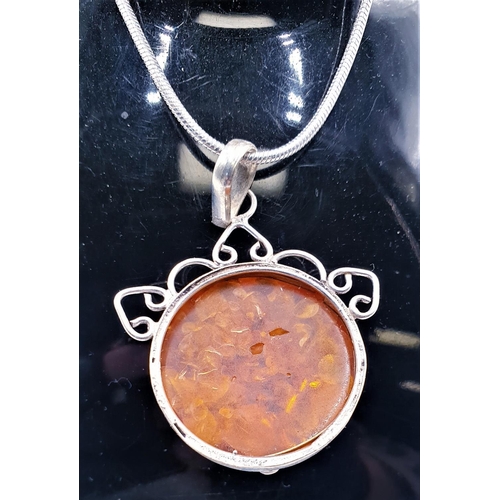 554 - STERLING SILVER (925) AMBER ? FLOWER PENDANT ON A 58 cm NECK CHAIN