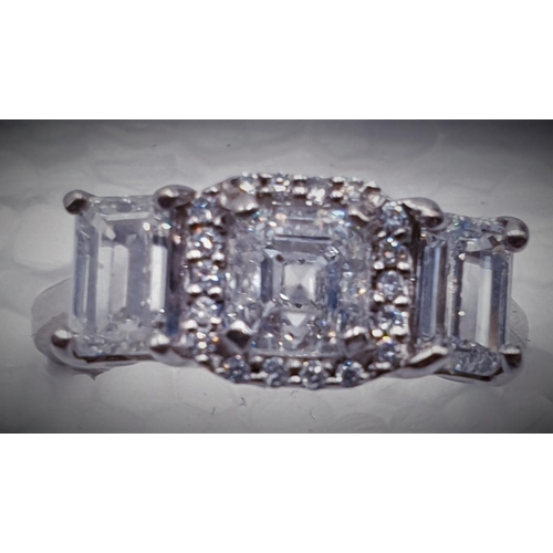 671 - 18ct WHITE GOLD RING With CENTRAL 0.90ct ASSCHER CUT DIAMOND SURROUNDED BY A DIAMOND HALO ALONG WITH... 