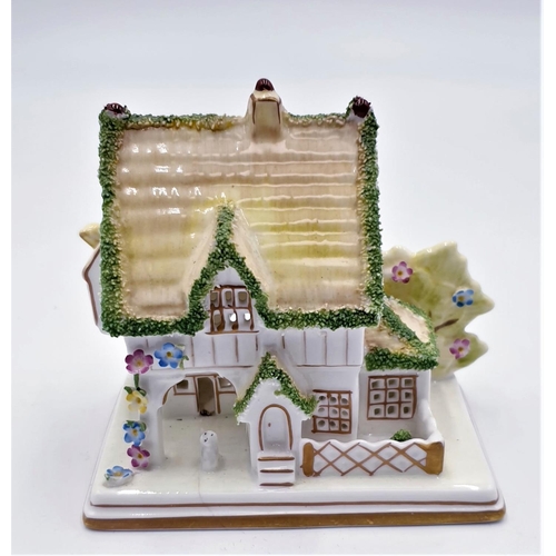 693 - COALPORT CHINA 9.5cm MODEL OF A COTTAGE 