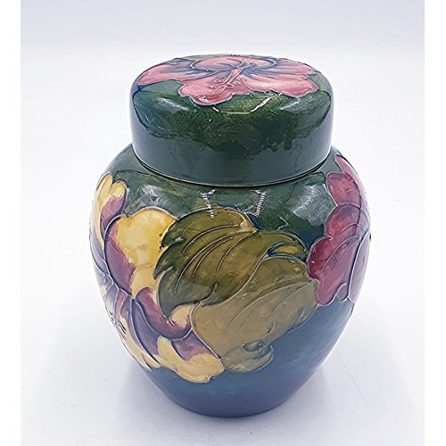 771 - MOORCROFT 14cm GINGER JAR IN THE HIBICUS DESIGN ON GREEN GROUND