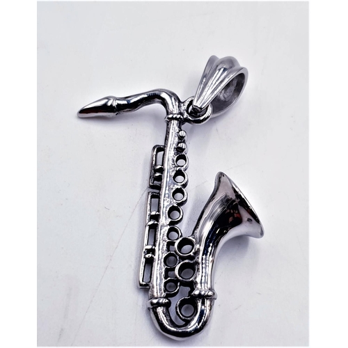 295 - WHITE METAL PENDANT FASHIONED AS A SAXOPHONE (Boxed)