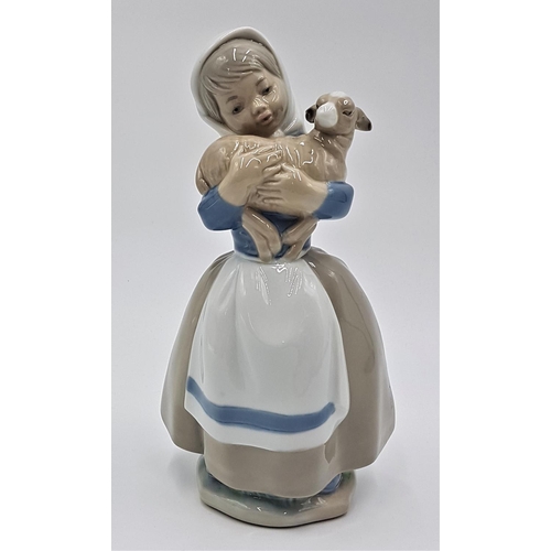 711 - LLADRO (Nao) PORCELAIN 20.5cm CHARACTER FIGURINE OF A GIRL WITH LAMB IN HER ARMS 