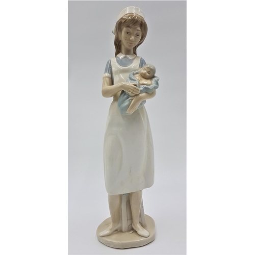 717 - LLADRO (Nao) PORCELAIN Extra Large 33cm x 9cm x 11cm CHARACTER FIGURINE OF A YOUNG NURSE HOLDING A N... 