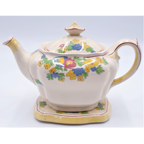 129 - ROYAL DOULTON CHINA TEAPOT And STAND IN THE MINDEN DESIGN