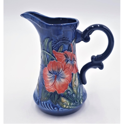 13 - OLD TUPTON WARE TUBELINED 15cm JUG IN THE HIBISCUS DESIGN ON DARK BLUE GROUND