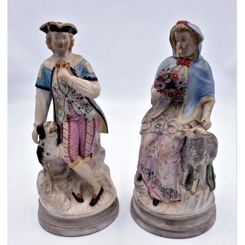 675 - BISQUE 28 cm FIGURINES (2) (A/F Male Was Originally Holding A Pheasant)