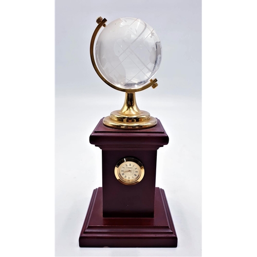 721 - CRYSTAL GLOBE ON 20cm WOODEN STAND TOGETHER WITH A CLOCK (Found To Be Working When Photographed)