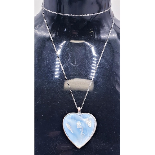 112 - WHITE METAL HEART SHAPED PENDANT ON A SILVER (925) 44cm NECK CHAIN