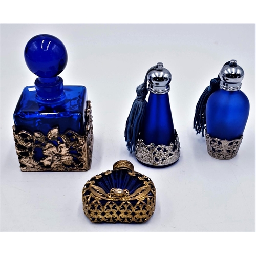 128 - BLUE GLASS COVERED PERFUME BOTTLES (4)