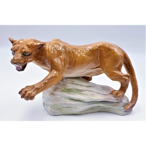 99 - ELITE POTTERY 15cm x 25cm MODEL OF A LIONESS ON A ROCK (Derek Powell B 1936)