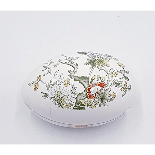 246 - MINTON CHINA 14cm EGG IN STAND TOGETHER WITH A ROYAL DOULTON CHINA 10.5cm x 6.5cm EGG SHAPED LIDDED ... 