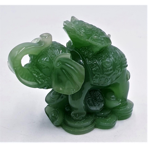 74 - JADE ? CARVED MODEL OF AN ELEPHANT