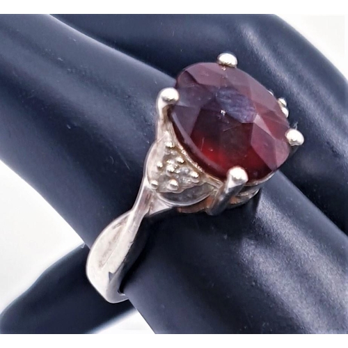 752 - STERLING SILVER (925) / OVAL CUT RED  STONE SET RING (Size Q, Total Weight 5.74 Grams)