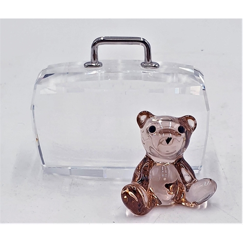 769 - SWAROVSKI CRYSTAL 4.5cm MODEL OF A TEDDY BEAR WITH SUITCASE 
(This retired Swarovski Crystal teddy b... 