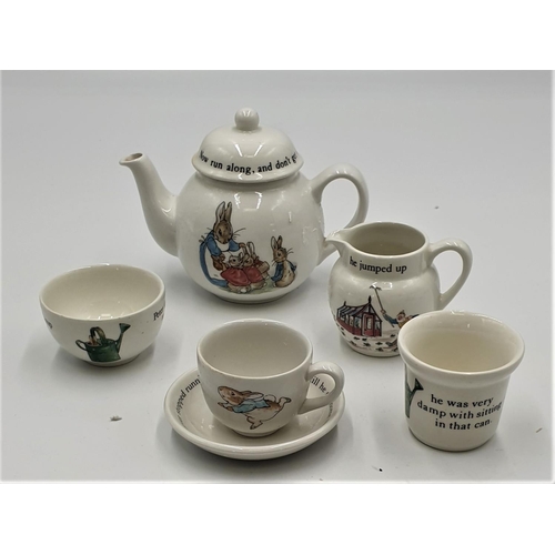 771 - WEDGWOOD CHINA BEATRIX POTTER TEAPOT, CUP, SAUCER, MILK, SUGAR & EGG CUP 'PETER RABBIT'