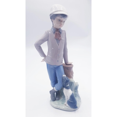 140 - LLADRO (Nao) PORCELAIN Large 23cm CHARACTER FIGURINE OF A YOUNG BOY LEANING AGIANST A TREE TRUNK Wit... 